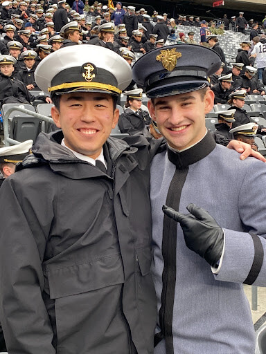 Army & Navy Academy Alumni at Army-Navy game. One cadet is attending West Point and the other cadet shown is at Annapolis.