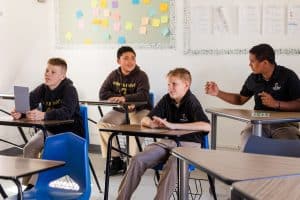 four boys attending a class