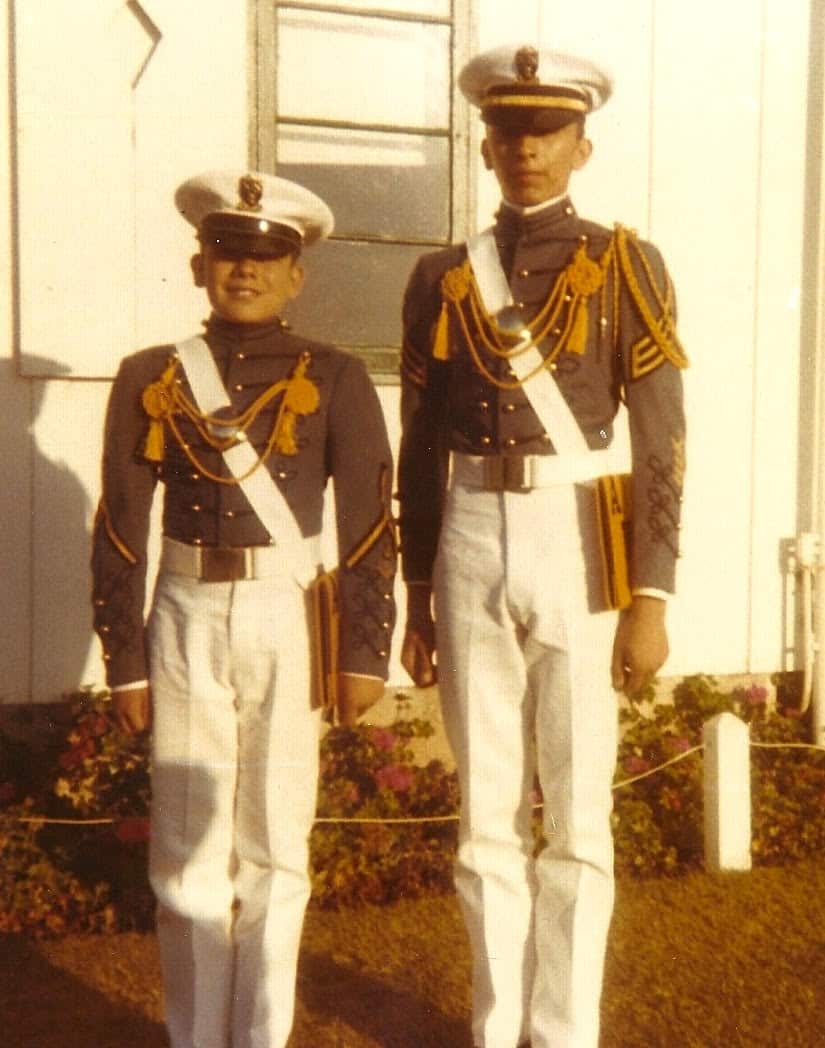 Distinguished alumni wearing Army and Navy Academy gear.